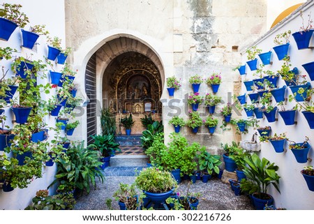 Cordoba, Andalusia Region, Spain. An old church with the traditional flowers set up of this town.