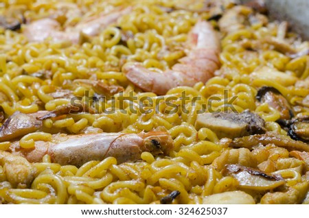 Detail of typical Valencian food noodles with prawns. Spanish food.