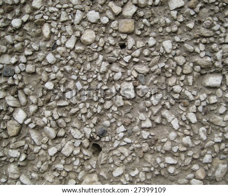 Wall of the house plastered by fine stones