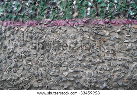 Wall of the house plastered by fine stones