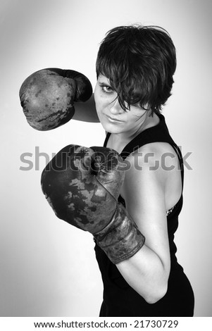 A girl with boxing gloves ready to knock you out