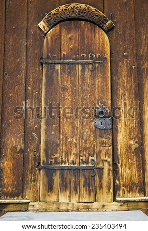Wooden door of old norwegian church
