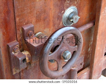 Features of an old rusty safe.
