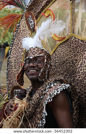 LEEDS, YORKSHIRE, UK: An unidentified parade participant, dressed as a Witch Doctor, smiles during the Leeds West Indian Carnival on August 31, 2009 in Leeds, UK.
