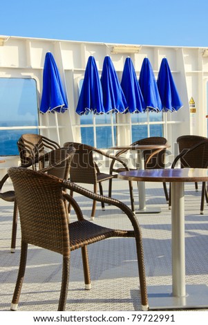 Chairs set out on the deck of a ship