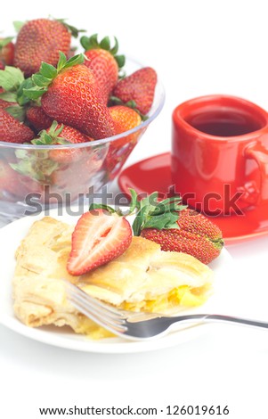 piece of apple pie, fork,cup of tea and strawberries isolated on white