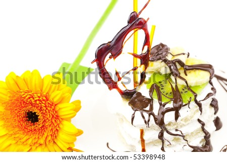 dessert with caramel hearts and a flower isolated on white