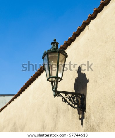 The lantern on the wall against the sky