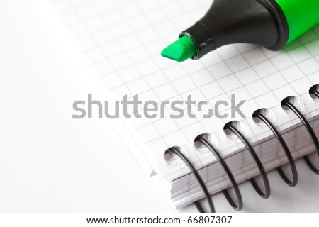 marker and notepad isolated on white