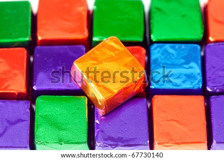 candies in shiny wrappers background