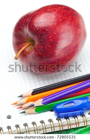apple, notebooks and pencils isolated on white
