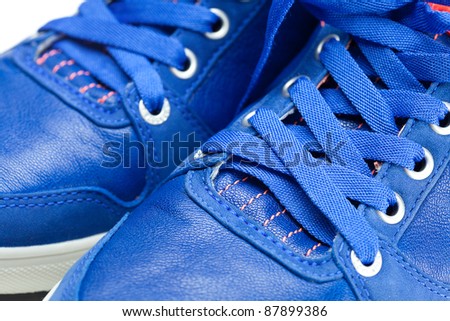 beautiful blue athletic shoes isolated on white