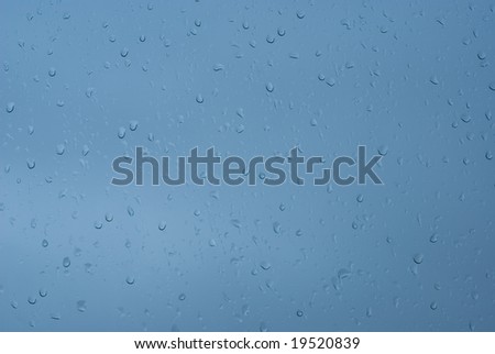 Raindrops on window during stormy weather