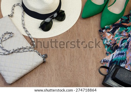 Collection of woman\'s summer essential accessories, overhead shoot