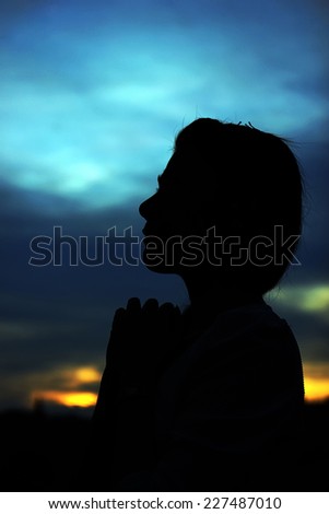 Pray shape body silhouette in sunset
