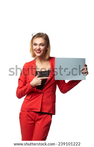 Beautiful smiling business woman wearing spectacles and in the red, holding a blank billboard , isolated on a white background
