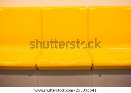Yellow chair in electric train