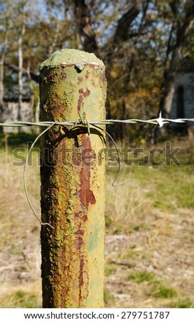 Rusted Green Post as part of Barbed Wire Fence on Abandoned Property, Outside of Kempner, Texas, USA