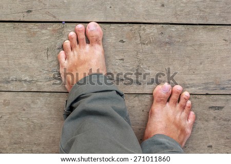 Bare feet on the wooden floor