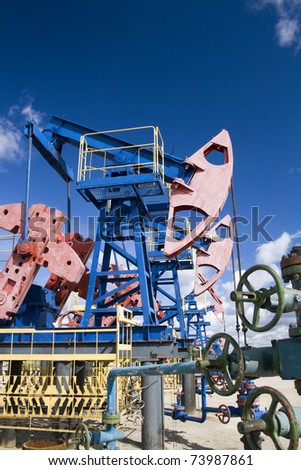 Oil and gas industry. Work of oil pump jack on a oil field