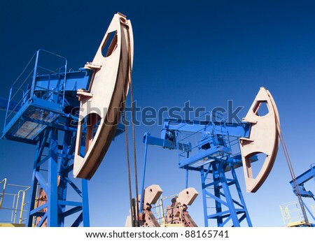Oil and gas industry. Work of oil pump jack on a oil field. Wide Angle