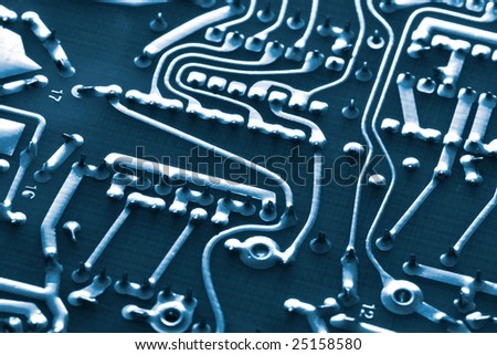 Close up macro of computer circuit board with soldered networks and paths