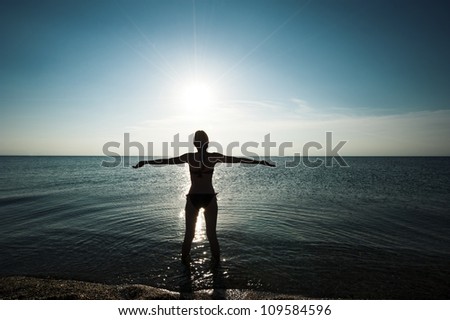 Woman in sunset