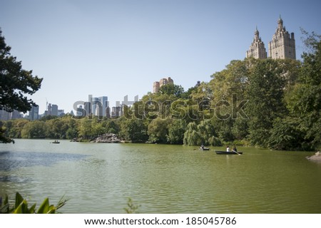 New York City, USA - September 14th, 2012. People riding in boats at Central Park. Large number of New Yorkers and tourists enjoy riding those boats at Lake.
