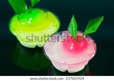 Thai dessert made from stirred bean mixed with sugar and coconut in jelly-like on black background