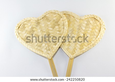 Weave fan heart shape made from bamboo on white background
