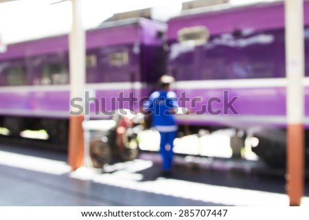 Blurred image of people is cleaning the train in railway station  for background