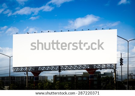 Blank billboard on blue sky on day time for advertisement