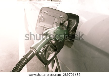 Gas pump nozzle in the fuel tank of dust car,vintage filter