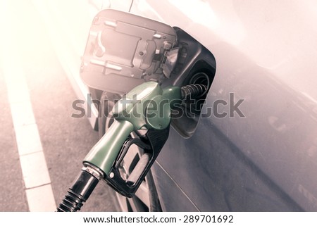 Gas pump nozzle in the fuel tank of dust car,vintage filter