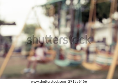 blurred image of children's playground at public park for background usage,vintage filter