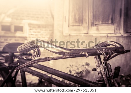 Closeup old rusty bicycle handle bar in vintage color tone