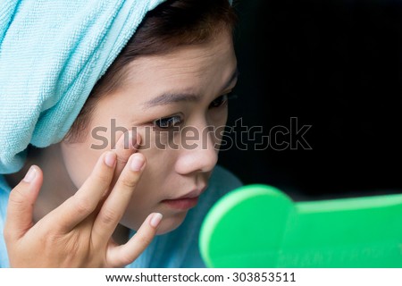 Makeup concept,Portrait of beautiful young woman applying foundation makeup on her face