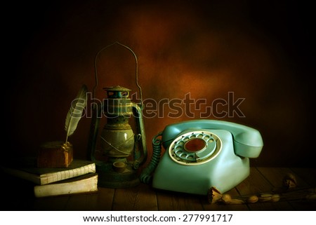 still life old telephone and old lamp ,old wood background