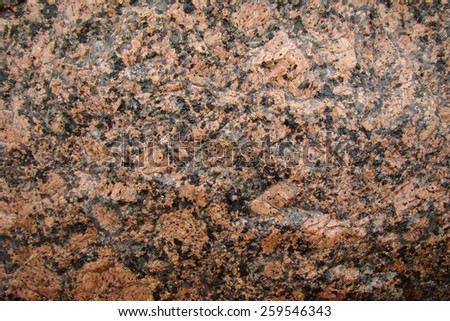 big wet stone brown-black granite as a background