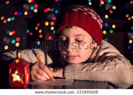 The child writes a letter to Santa Claus