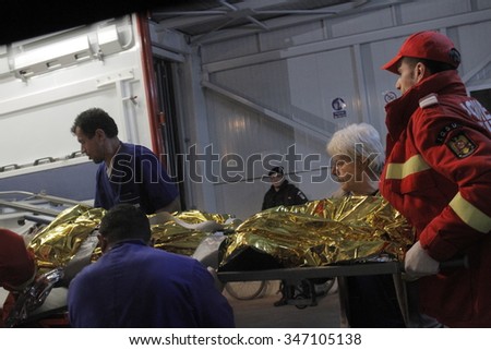 Bucharest, Romania, October 31, 2015: Romanian paramedics transfer a wounded person, who survived from a fire at a Colectiv Club from the Emergency Hospital Floreasca to a burn center.
