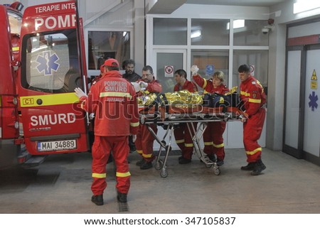 Bucharest, Romania, October 31, 2015: Romanian paramedics transfer a wounded person, who survived from a fire at Colectiv Club from the Emergency Hospital Floreasca to a burn center.