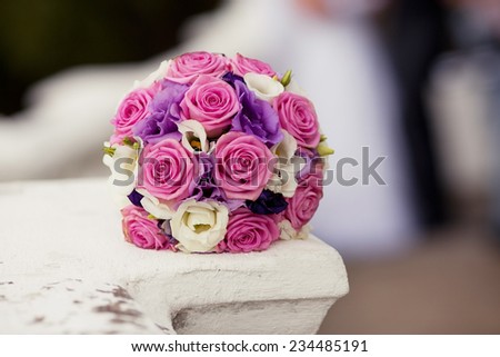 Pastel wedding bouquet with roses and eustomas