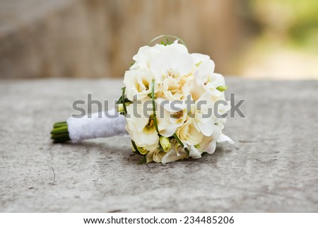 Pastel wedding bouquet with roses and orchids