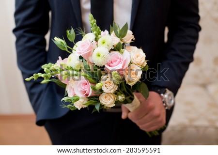 Beautiful wedding colorful nosegay of pink and peach roses