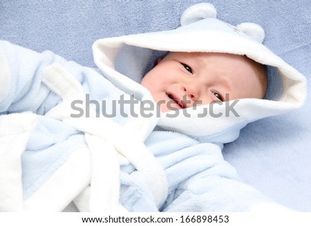 little baby crying on bed