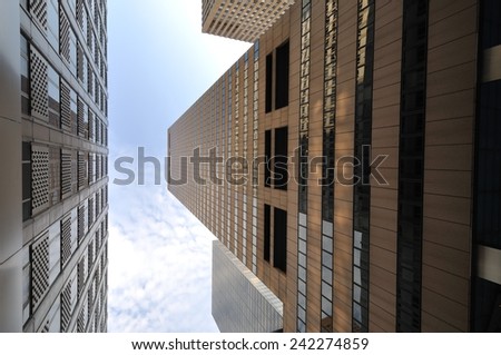 bottom view of two buildings on a street in New York City