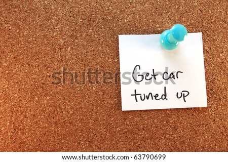 Get Car Tuned Up A get car tuned up note tacked on corkboard. Horizontal.