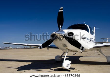 Private Airplane A private single engine propeller airplane. Horizontal.