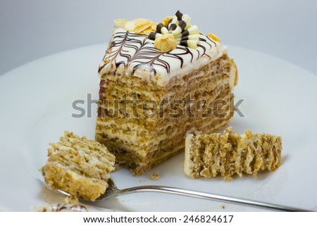 slices of cake and spoon on a white plate